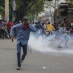 Rising Tensions: Haiti PM Pleads for Peace Amidst Uproar