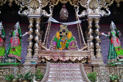 Lord Banke Bihari sitting in a swing made of gold and silver