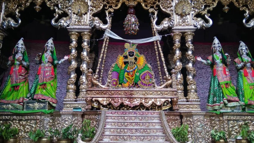 Lord Banke Bihari sitting in a swing made of gold and silver