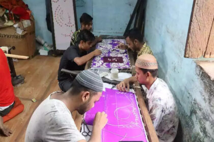 Hindu and Muslim artisans busy preparing costumes for Lord Krishna before Janmashtami in Vrindavan