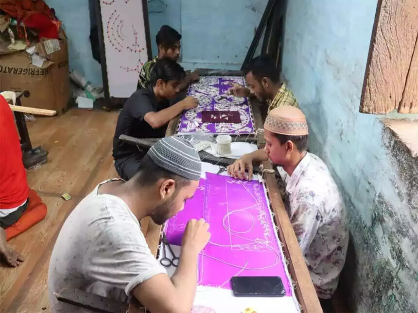 Hindu and Muslim artisans busy preparing costumes for Lord Krishna before Janmashtami in Vrindavan